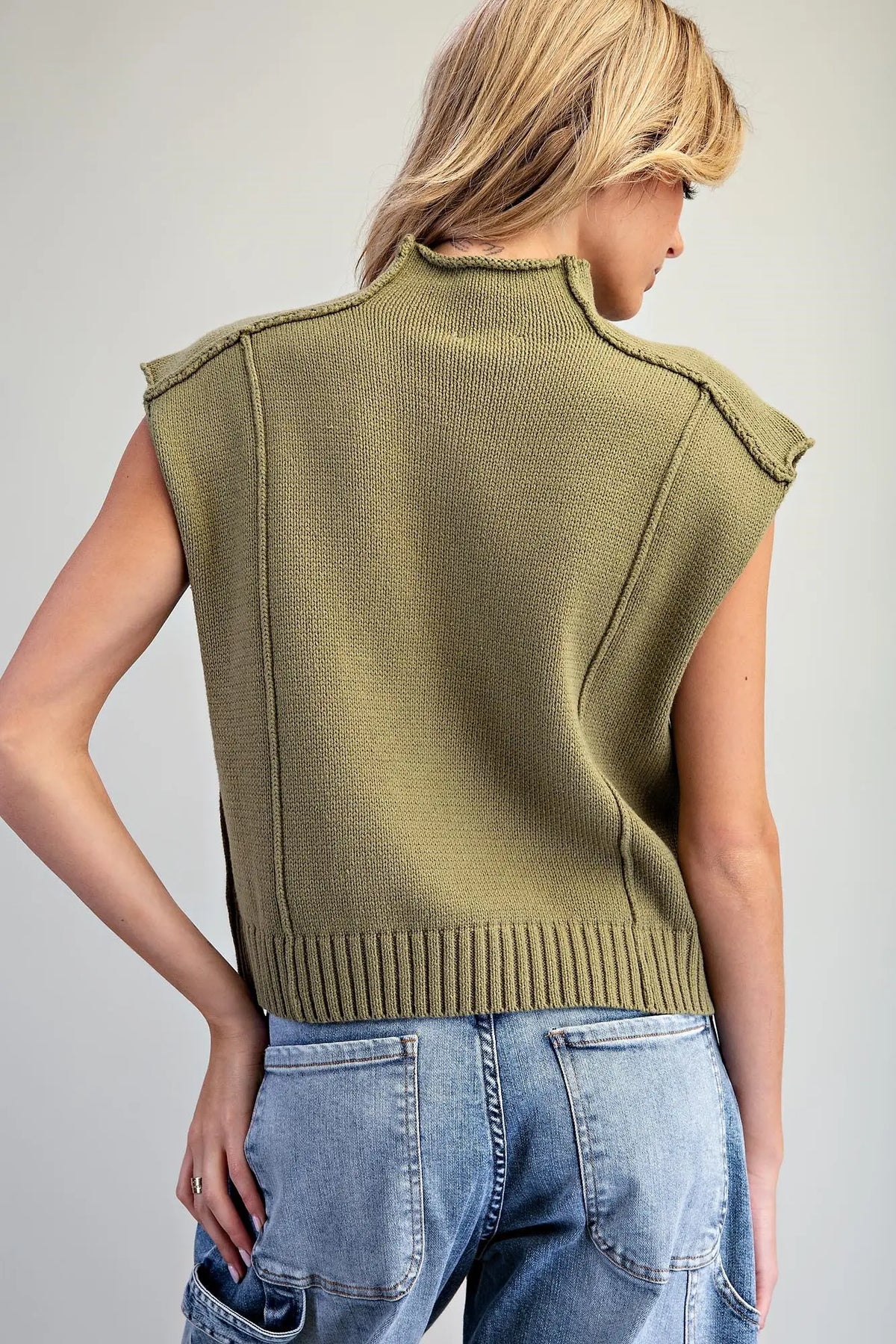 Mock Neck Exposed Seam Knit Top
